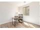 Bright home office with wooden floors, a desk, and a window at 3875 E Claxton Ave, Gilbert, AZ 85297