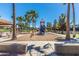 Community playground with slides, swings, and picnic tables in a sunny park at 3875 E Claxton Ave, Gilbert, AZ 85297