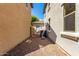 Narrow side yard featuring gravel, space for AC unit, and access to the backyard at 3875 E Claxton Ave, Gilbert, AZ 85297