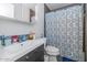 Functional bathroom with vanity sink, decorative mirror, and a shower-tub combo at 4606 W Park Ave, Chandler, AZ 85226