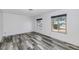 Bright and airy bedroom featuring sleek flooring and ample natural light from multiple windows at 4606 W Park Ave, Chandler, AZ 85226
