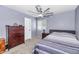Comfortable bedroom with a ceiling fan, large window, and a chest of drawers at 4606 W Park Ave, Chandler, AZ 85226