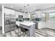 Modern kitchen featuring stainless steel appliances, stylish backsplash, and a functional island at 4606 W Park Ave, Chandler, AZ 85226
