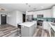 Updated kitchen with stainless steel appliances, kitchen island and modern design at 4606 W Park Ave, Chandler, AZ 85226