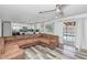 Open-concept living area with stylish flooring, and seamless access to outdoor pool through sliding glass doors at 4606 W Park Ave, Chandler, AZ 85226