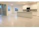 Bright open-concept kitchen features a large island, white cabinets, and stainless steel appliances at 4747 S Carver --, Mesa, AZ 85212