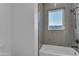 Well-lit bathroom showing modern fixtures and neutral tile at 475 W Saddle Mountain Rd, Phoenix, AZ 85086