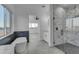 Modern bathroom showcasing a sleek soaking tub, a walk-in shower, and a view of the outdoors at 475 W Saddle Mountain Rd, Phoenix, AZ 85086