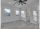 Sunlit bedroom with two large windows and tile flooring, creating a spacious atmosphere at 475 W Saddle Mountain Rd, Phoenix, AZ 85086