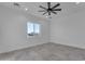 Bright bedroom with a large window offering natural light, and tile floors at 475 W Saddle Mountain Rd, Phoenix, AZ 85086