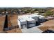 Modern home featuring a clean white exterior, a flat roof, and an extended concrete driveway at 475 W Saddle Mountain Rd, Phoenix, AZ 85086