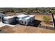 Modern-style home showcasing a pristine white exterior and minimalist design with many windows at 475 W Saddle Mountain Rd, Phoenix, AZ 85086
