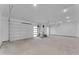 Spacious garage with concrete floors and two car doors, providing ample parking and storage at 475 W Saddle Mountain Rd, Phoenix, AZ 85086