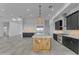 Modern kitchen with an island, stainless steel appliances, and stylish pendant lighting at 475 W Saddle Mountain Rd, Phoenix, AZ 85086