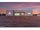 Modern home's rear exterior with large windows and doors, providing seamless indoor-outdoor living at 475 W Saddle Mountain Rd, Phoenix, AZ 85086