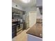 Well-equipped kitchen features stainless steel appliances, granite countertops, and mosaic tile backsplash at 5345 E Van Buren St # 209, Phoenix, AZ 85008