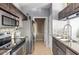Efficient kitchen with stainless appliances, ample countertop space, and stylish tile backsplash at 5345 E Van Buren St # 209, Phoenix, AZ 85008