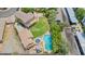 Aerial view of a backyard with a large lawn, pool, and outdoor recreational area at 5787 W Barbara Ave, Glendale, AZ 85302