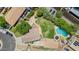 Sprawling property featuring a sparkling pool, lush green lawn, mature trees, and ample parking at 5787 W Barbara Ave, Glendale, AZ 85302