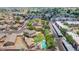 A beautiful aerial view of the neighborhood showcasing mature landscaping, pool, and community spaces at 5787 W Barbara Ave, Glendale, AZ 85302