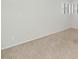 Empty bedroom featuring neutral carpet, white walls, ceiling fan, and a window allowing natural light at 5787 W Barbara Ave, Glendale, AZ 85302