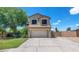 Charming two-story home with a well-manicured lawn and inviting curb appeal on a sunny day at 5787 W Barbara Ave, Glendale, AZ 85302