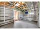 Bright garage with shelving and an exterior door at 5787 W Barbara Ave, Glendale, AZ 85302