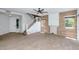 Bright living room with wood look floors, stylish ceiling fan, and staircase leading to the upper level at 5787 W Barbara Ave, Glendale, AZ 85302