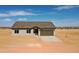 Charming single-story home featuring desert landscaping and a neutral color scheme at 5937 N Nigal Rd, Casa Grande, AZ 85194