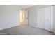 A carpeted bedroom offers ample closet space, and neutral tones at 6214 W Sunnyside Dr, Glendale, AZ 85304