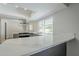 Modern kitchen featuring stainless steel appliances, white countertops, gray cabinets, and recessed lighting at 6214 W Sunnyside Dr, Glendale, AZ 85304