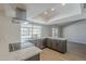 Modern kitchen featuring stainless steel appliances, gray cabinets, white countertops, and a view of the pool at 6214 W Sunnyside Dr, Glendale, AZ 85304