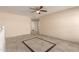 Spacious bonus room with decorative tile flooring, neutral walls, and ceiling fan for added comfort at 6337 W Valencia Dr, Laveen, AZ 85339