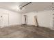 Large, clean garage with garage door and side door for convenient access at 6337 W Valencia Dr, Laveen, AZ 85339