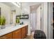 Functional bathroom featuring a vanity with sink, mirrored wall cabinet, and shower-tub combination at 6638 W Nez Perce St, Phoenix, AZ 85043