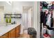 Well-organized bathroom and closet featuring a vanity with sink, mirrored wall cabinet, and shower-tub combination at 6638 W Nez Perce St, Phoenix, AZ 85043