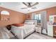 Cozy bedroom features a ceiling fan, a comfy bed, and soft natural lighting at 6638 W Nez Perce St, Phoenix, AZ 85043
