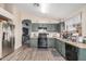 Modern kitchen with stainless steel appliances and ample counter space at 6638 W Nez Perce St, Phoenix, AZ 85043