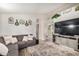 Spacious living room with a large sectional sofa and modern decor at 6638 W Nez Perce St, Phoenix, AZ 85043