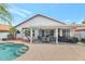 Beautiful backyard with a covered patio, a pool, and mature landscaping, ideal for relaxing at 6915 E Lakeview Ave, Mesa, AZ 85209