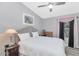 Bright bedroom featuring a ceiling fan, neutral color palette, and plush carpeting at 6915 E Lakeview Ave, Mesa, AZ 85209