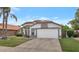 Inviting single-Gathering home with an attached two-car garage, complemented by mature trees and landscaping at 6915 E Lakeview Ave, Mesa, AZ 85209