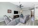 Comfortable living room area with ceiling fan, modern furniture, and vaulted ceiling at 6915 E Lakeview Ave, Mesa, AZ 85209