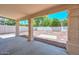 Spacious covered patio with a low maintenance backyard, ideal for outdoor enjoyment at 6928 W Oraibi Dr, Glendale, AZ 85308