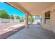 Covered patio offers views of the rock landscaped backyard, perfect for entertaining or relaxing at 6928 W Oraibi Dr, Glendale, AZ 85308