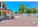Expansive backyard with rock landscaping and covered patio, perfect for outdoor living and enjoyment at 6928 W Oraibi Dr, Glendale, AZ 85308