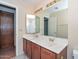 The bathroom offers dual sinks, vanity with generous counter space, and a large mirror at 6928 W Oraibi Dr, Glendale, AZ 85308