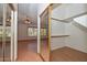 Bedroom with a walk-in closet offering a combination of style and functionality at 6928 W Oraibi Dr, Glendale, AZ 85308