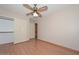 This cozy bedroom features wood laminate flooring and ample closet space at 6928 W Oraibi Dr, Glendale, AZ 85308