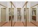 Mirrored closet doors offer a glimpse into the primary bath area, creating a seamless flow at 6928 W Oraibi Dr, Glendale, AZ 85308